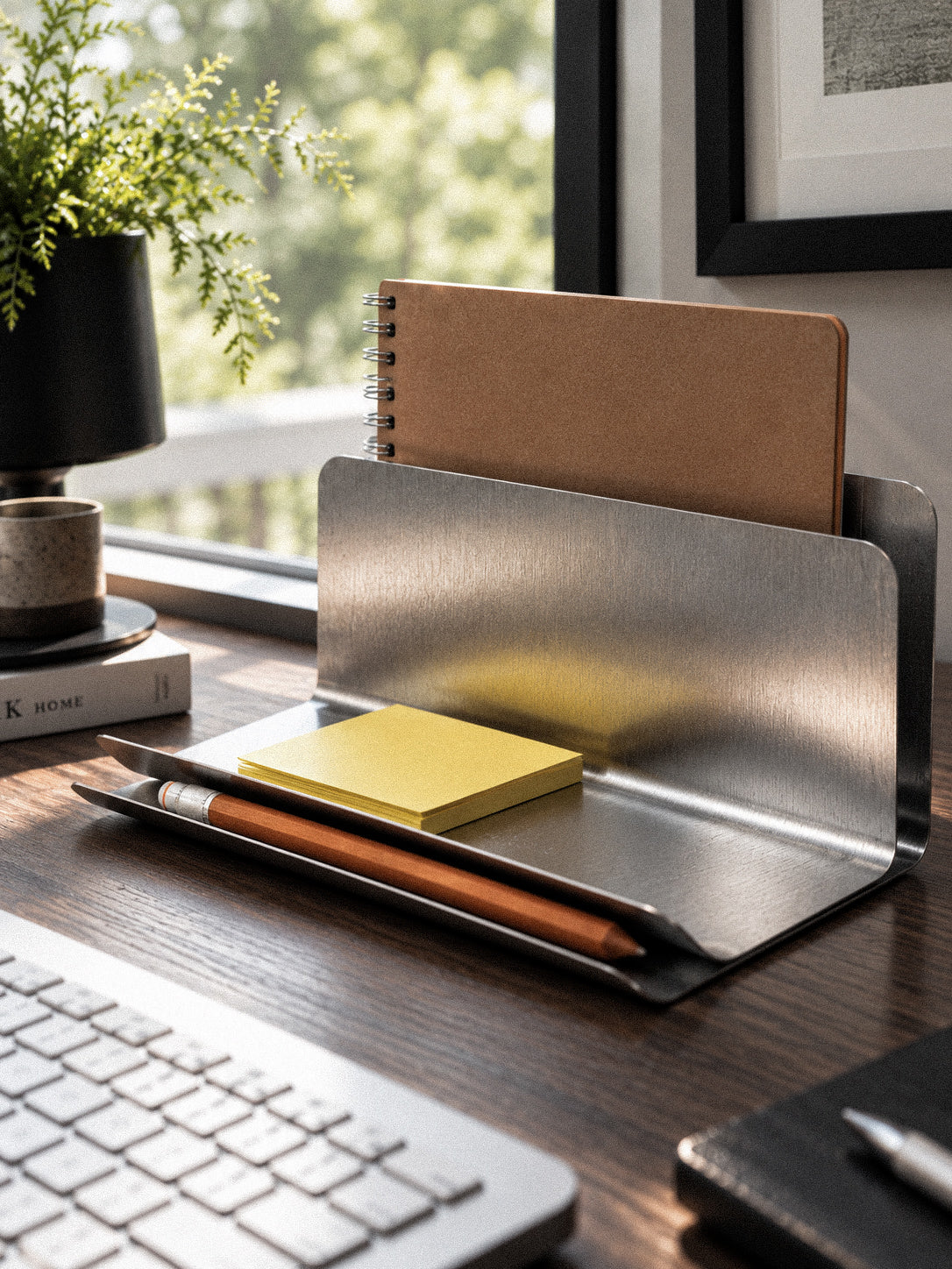 Close-up of FORM/17 Desk Dock's upright notebook slot and front stationery tray